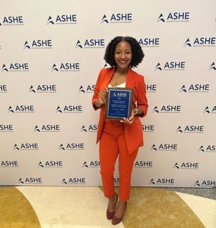 Krystal L. Williams recieves award at ASHE