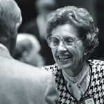 Louise McBee on the floor of the State House of Representatives talking to fellow legislator (unidentified). Photo taken 1/13/92. (University of Georgia/ University of Georgia, Rick O'Quinn).